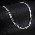 Encliff Cuban link chain with thick, interlocking gold-toned links, showcasing a stylish and durable jewelry piece.